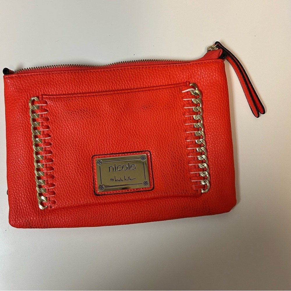 Nicole Miller orange clutch bag with logo